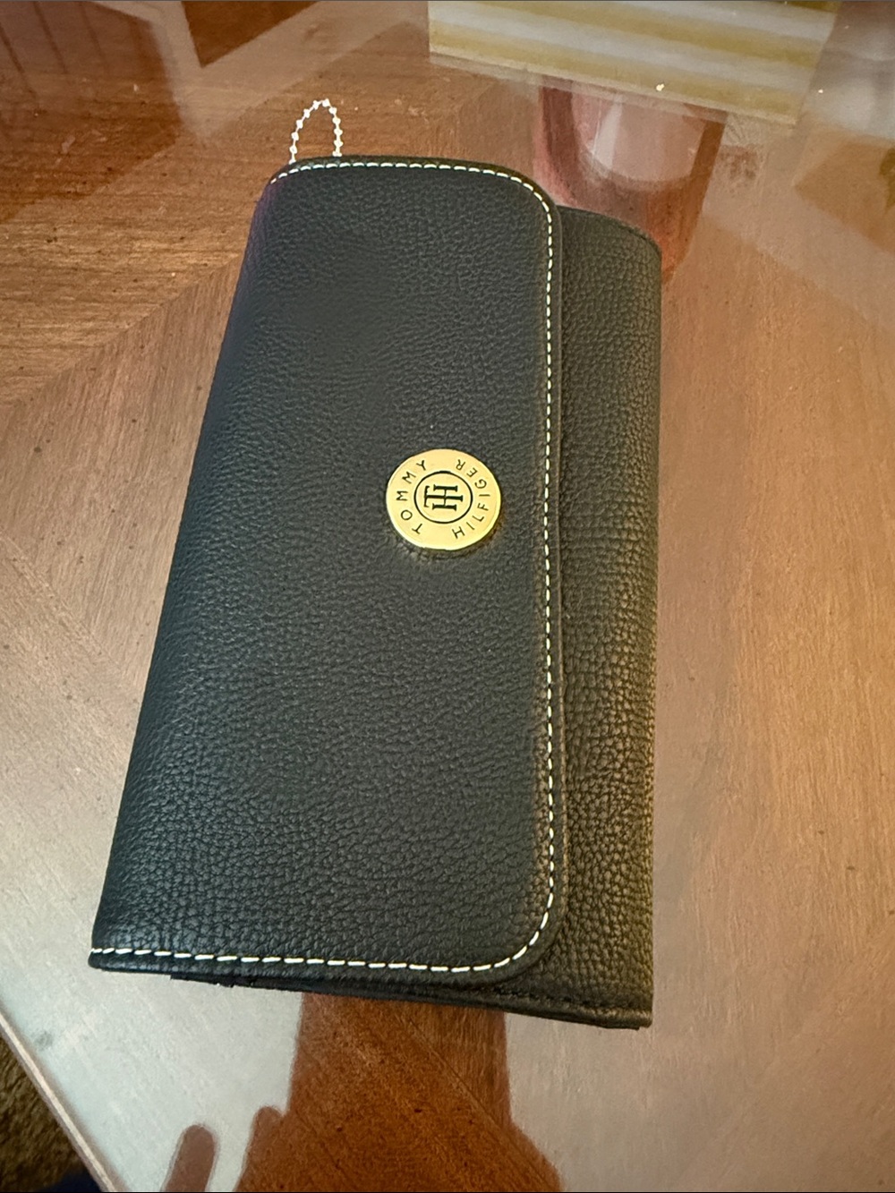Tommy Hilfiger Black Wallet with Gold Emblem and White Stitching